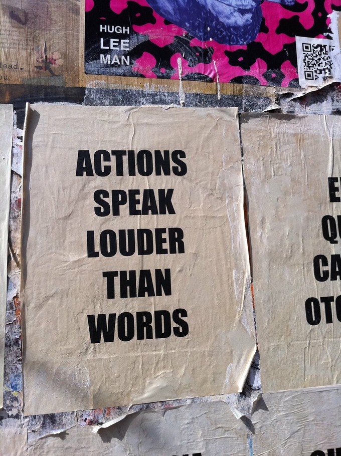 Photo of poster reading "Actions speak louder than words"