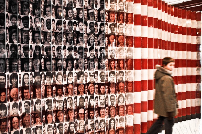 A U.S. flag imprinted with images of faces of immigrants